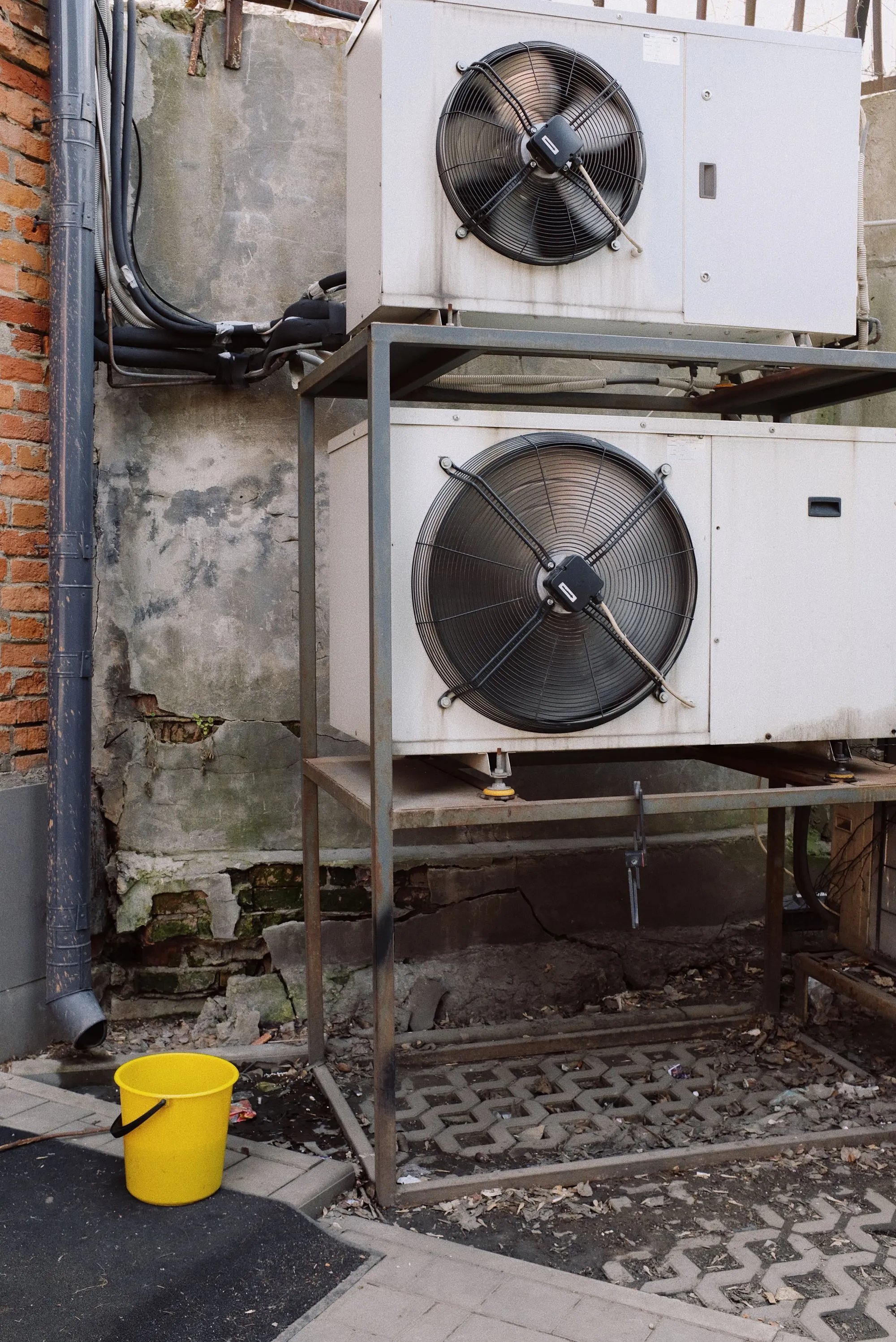 Commercial air conditioning condenser units mounted on a metal frame